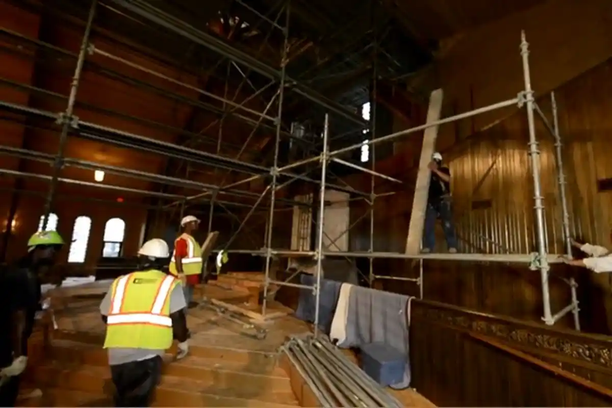 Restoration crew performing structural repair and renovation work